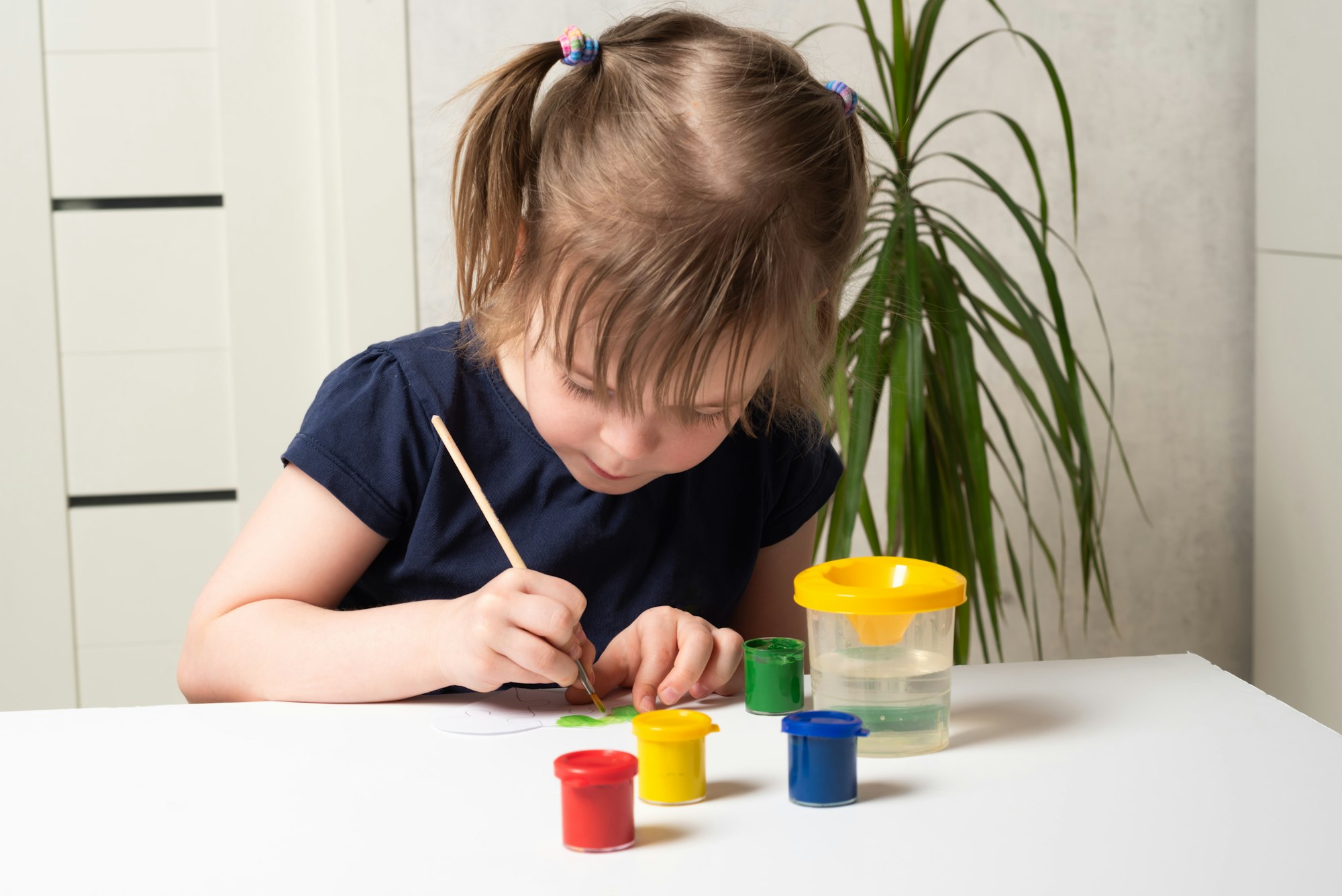 Children coloring hearts for World Autism Awareness Day